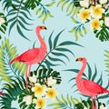 Seamless tropical pattern with exotic leaves, flowers and flamingos.